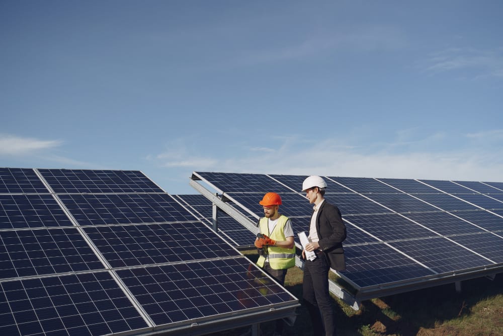 A panoramic landscape depicting a modern residential neighborhood, with solar panels prominently displayed on the rooftops of several homes. The sun casts a warm, golden glow across the scene, highlighting the sleek, efficient design of the solar panels. In the foreground, a detailed breakdown of the current costs, incentives, and federal tax credits associated with installing home solar systems is displayed on a floating display, providing a clear and informative visual aid. The middle ground features a few homeowners admiring their newly installed solar panels, expressions of satisfaction and pride evident on their faces. The background showcases a cityscape, underscoring the widespread adoption of renewable energy solutions. The overall mood is one of optimism, sustainability, and financial empowerment.