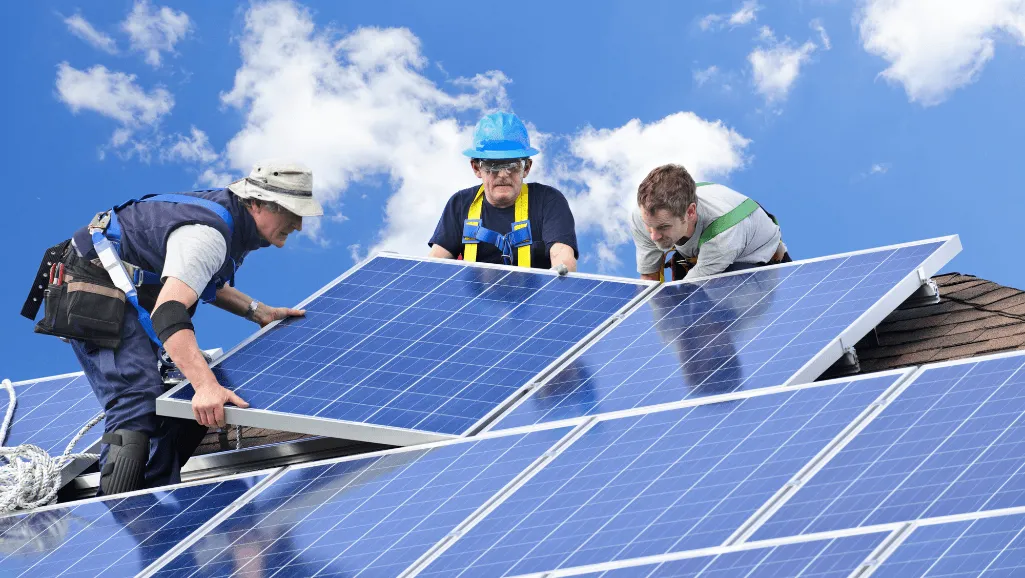 A well-equipped solar panel installation crew at work, dressed in professional uniforms, carefully aligning and securing the panels on a residential rooftop. The scene is bathed in warm, golden afternoon sunlight, casting dynamic shadows and highlights that emphasize the skilled, hands-on nature of their labor. In the middle ground, a team supervisor monitors the progress, ensuring precision and safety. In the background, a suburban neighborhood with lush, green trees frames the hardworking installation team, reflecting the harmonious integration of renewable energy technology into the local community. A well-equipped solar panel installation crew at work, dressed in professional uniforms, carefully aligning and securing the panels on a residential rooftop. The scene is bathed in warm, golden afternoon sunlight, casting dynamic shadows and highlights that emphasize the skilled, hands-on nature of their labor. In the middle ground, a team supervisor monitors the progress, ensuring precision and safety. In the background, a suburban neighborhood with lush, green trees frames the hardworking installation team, reflecting the harmonious integration of renewable energy technology into the local community.